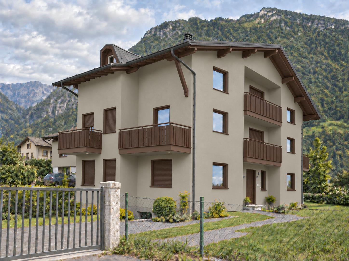 Proposta dell'edificio in località Valzella con facciata grigio caldo e finiture color noce, cancello scorrevole chiuso e rete esistente continua